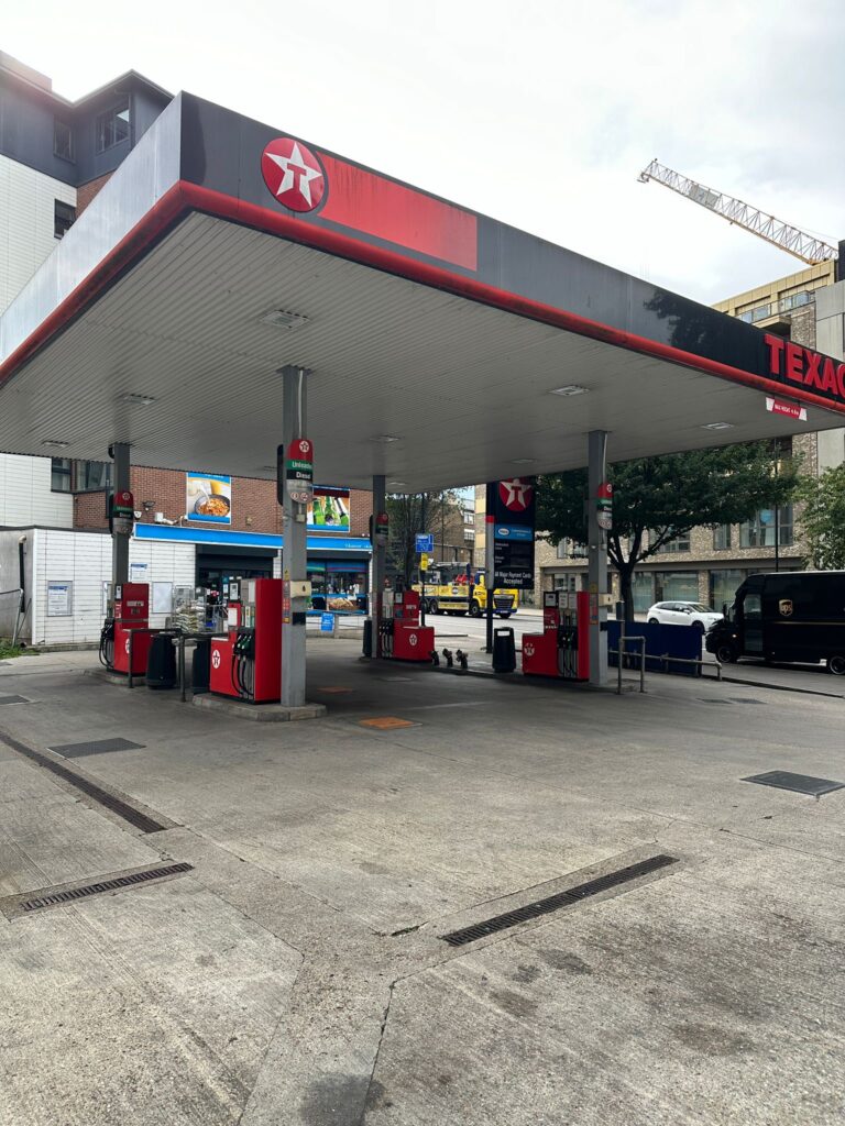 Gas station with multiple fuel pumps.