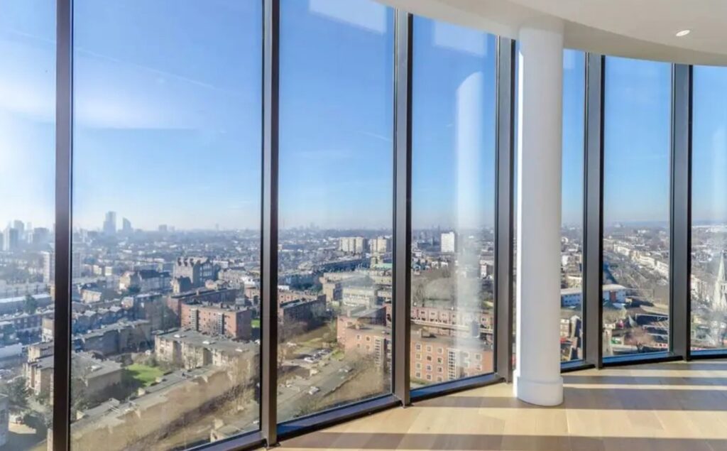 City skyline view from large glass windows.