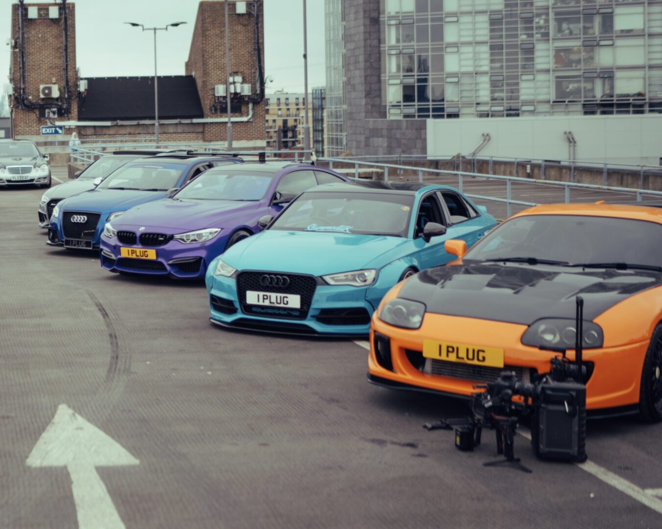 Four colorful cars parked in a row.