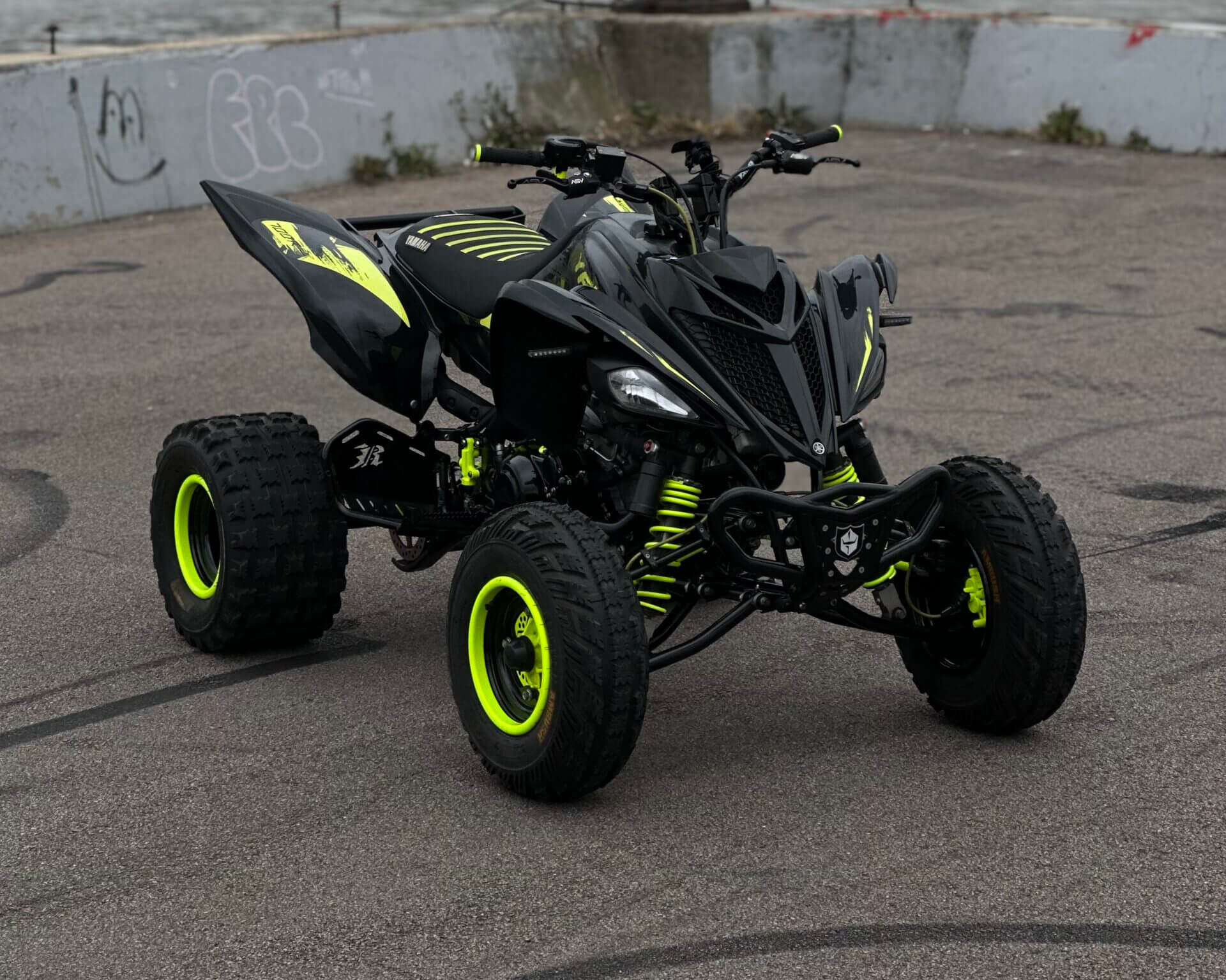 Black and neon yellow all-terrain vehicle.